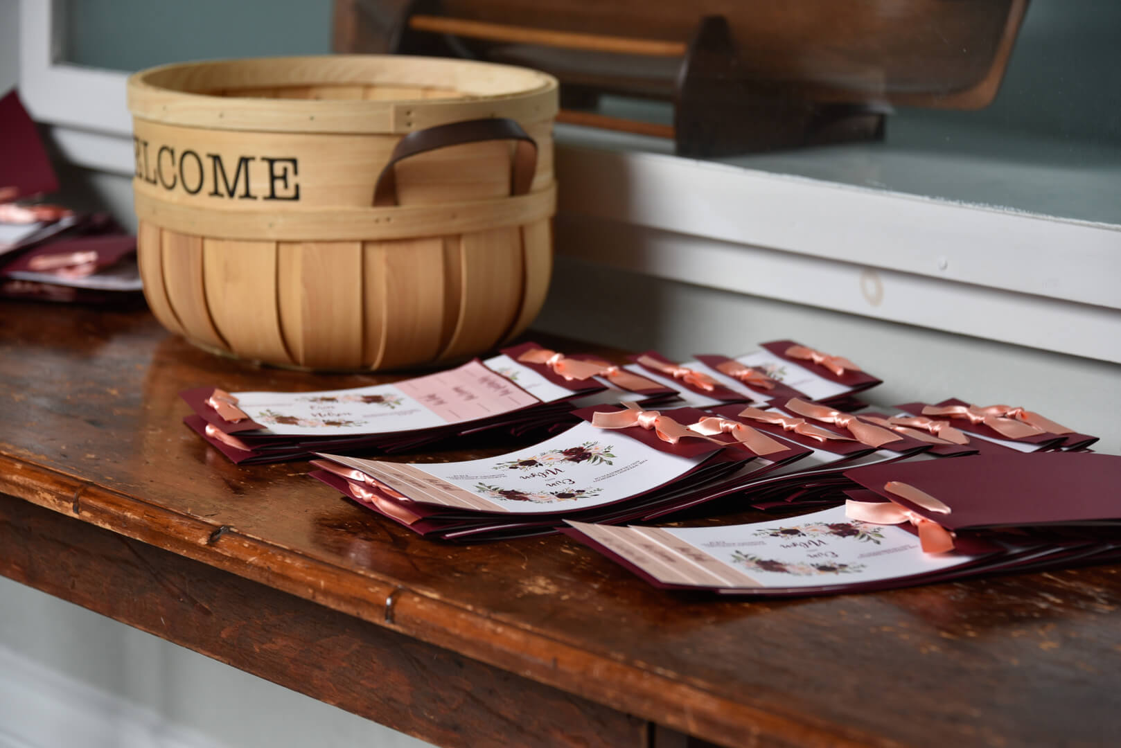 Event cards and basket with welcome text on a table